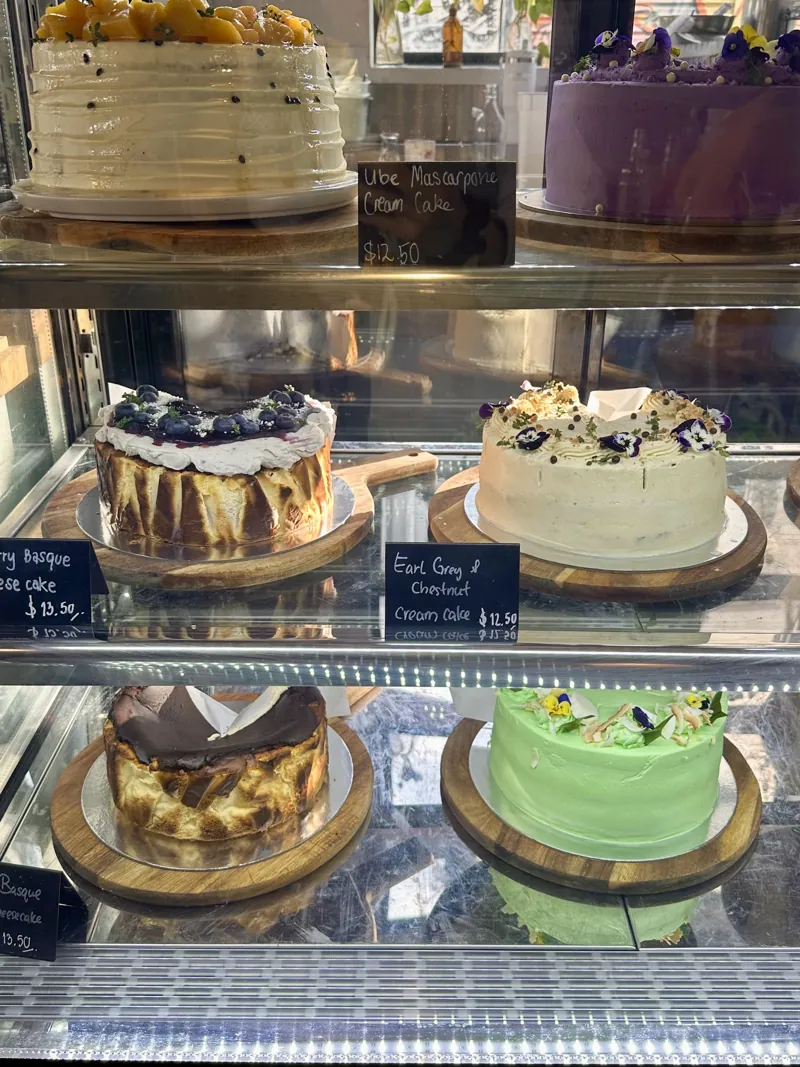 The Sir Charles cake cabinet stacked with whole layered cakes