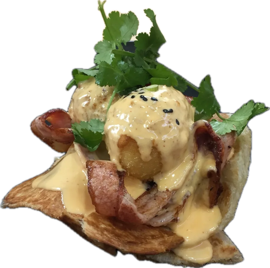 The Sir Charles Benedict: panko-crumbed eggs and sriracha hollandaise over bacon on roti