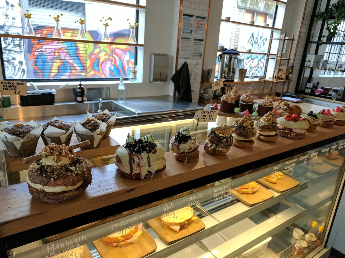 The pastry and cake counter by the street-art windows